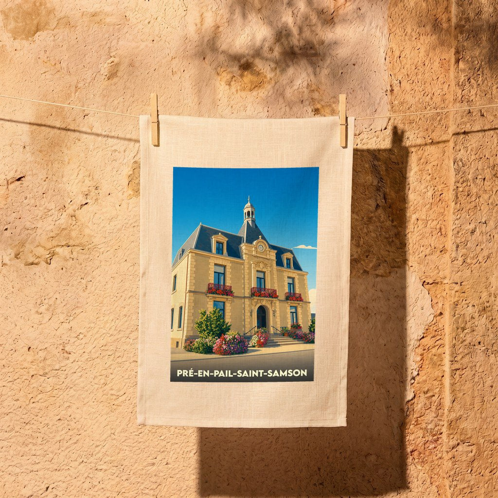 Torchon souvenir de la ville de Pré-en-Pail-Saint-Samson illustré de la mairie stylisée sous un ciel bleu.