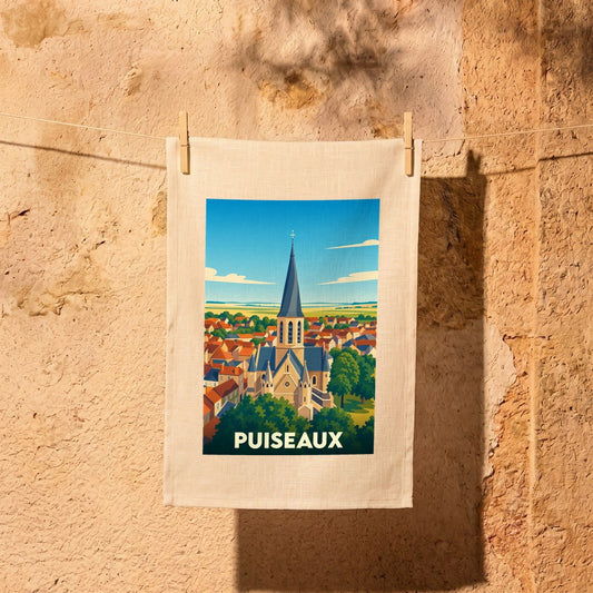 Torchon souvenir de la ville de Puiseaux avec une illustration stylisée de son église et de ses toits.