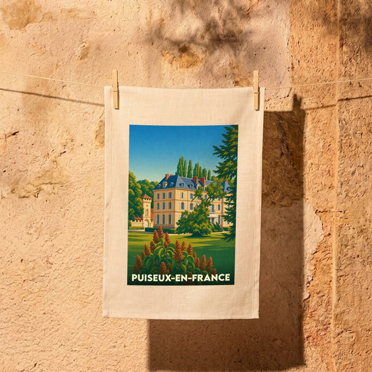 Torchon souvenir de la ville de Puiseux-en-France avec une illustration stylisée d'un château.