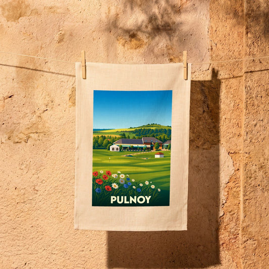 Torchon souvenir de la ville de Pulnoy avec une illustration stylisée de son paysage champêtre.