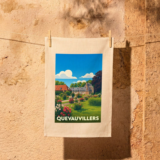Torchon souvenir de la ville de Quevauvillers avec une illustration stylisée d'un château fleuri.