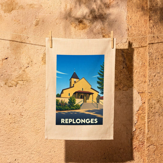 Torchon souvenir de la ville de Replonges avec une illustration stylisée de son église.