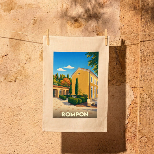 Torchon souvenir de la ville de Rompon illustré par une scène de village ensoleillée.