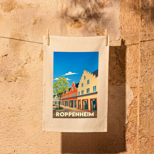 Torchon souvenir de la ville de Roppenheim avec une illustration stylisée de bâtiments traditionnels alsaciens.