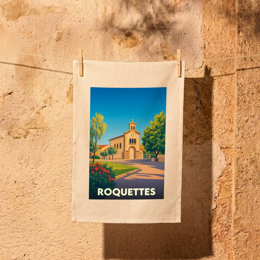 Torchon souvenir de la ville de Roquettes avec une illustration stylisée de son église.