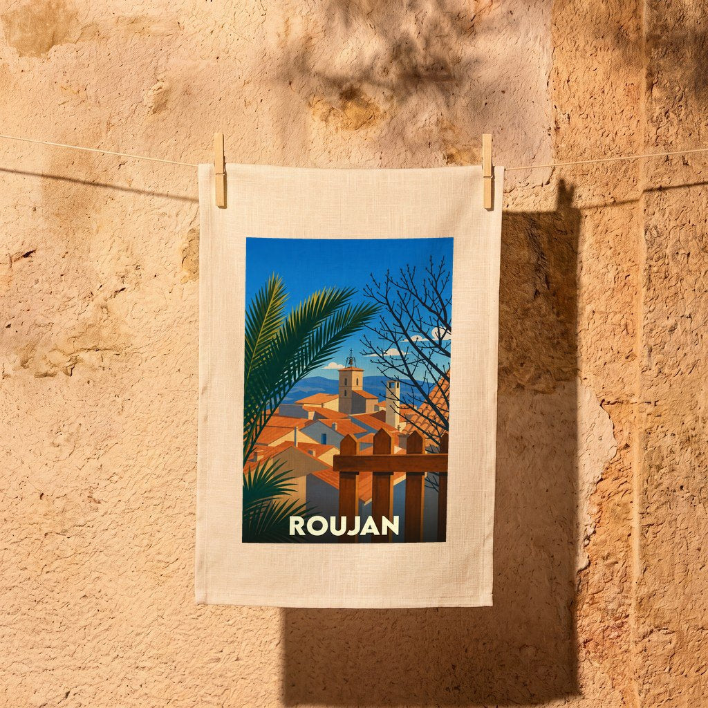Torchon souvenir de la ville de Roujan avec une illustration stylisée d'un paysage urbain méditerranéen.
