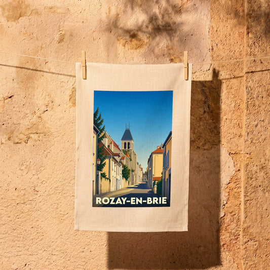 Torchon souvenir de la ville de Rozay-en-Brie avec une illustration stylisée d'une rue historique.