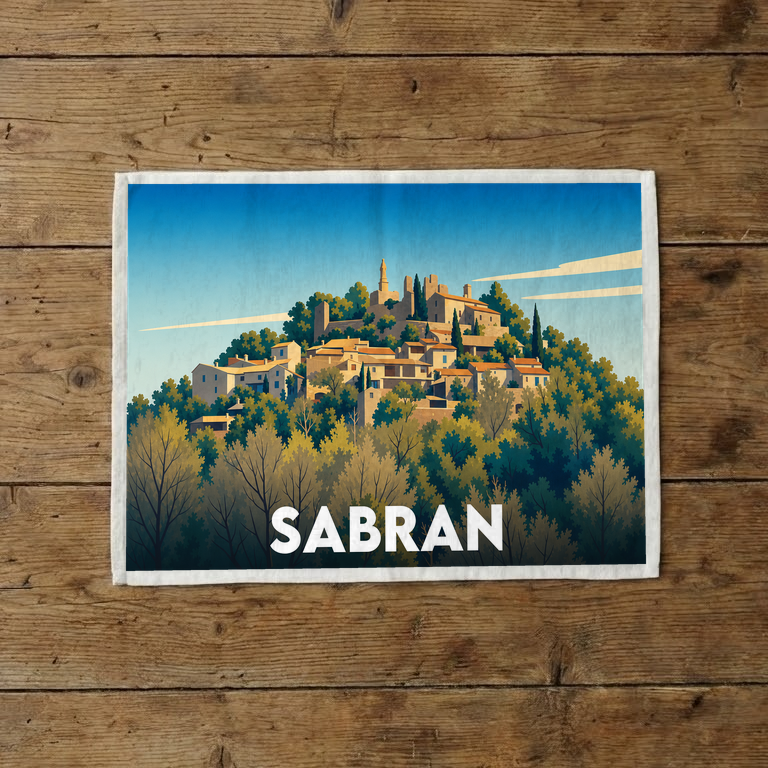 Torchon souvenir de la ville de Sabran avec une illustration stylisée du village perché.