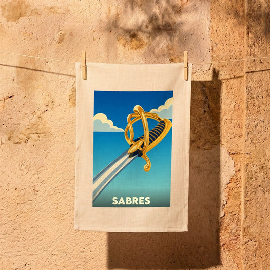 Torchon souvenir de la ville de Sabres avec une illustration stylisée d'un sabre.