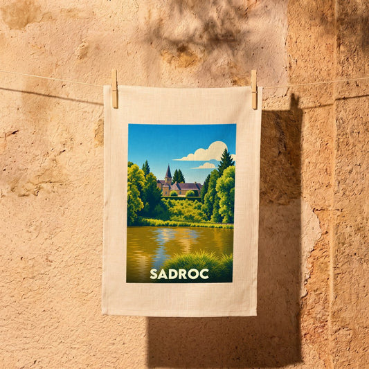 Torchon souvenir de la ville de Sadroc avec une illustration stylisée d'un paysage lacustre.
