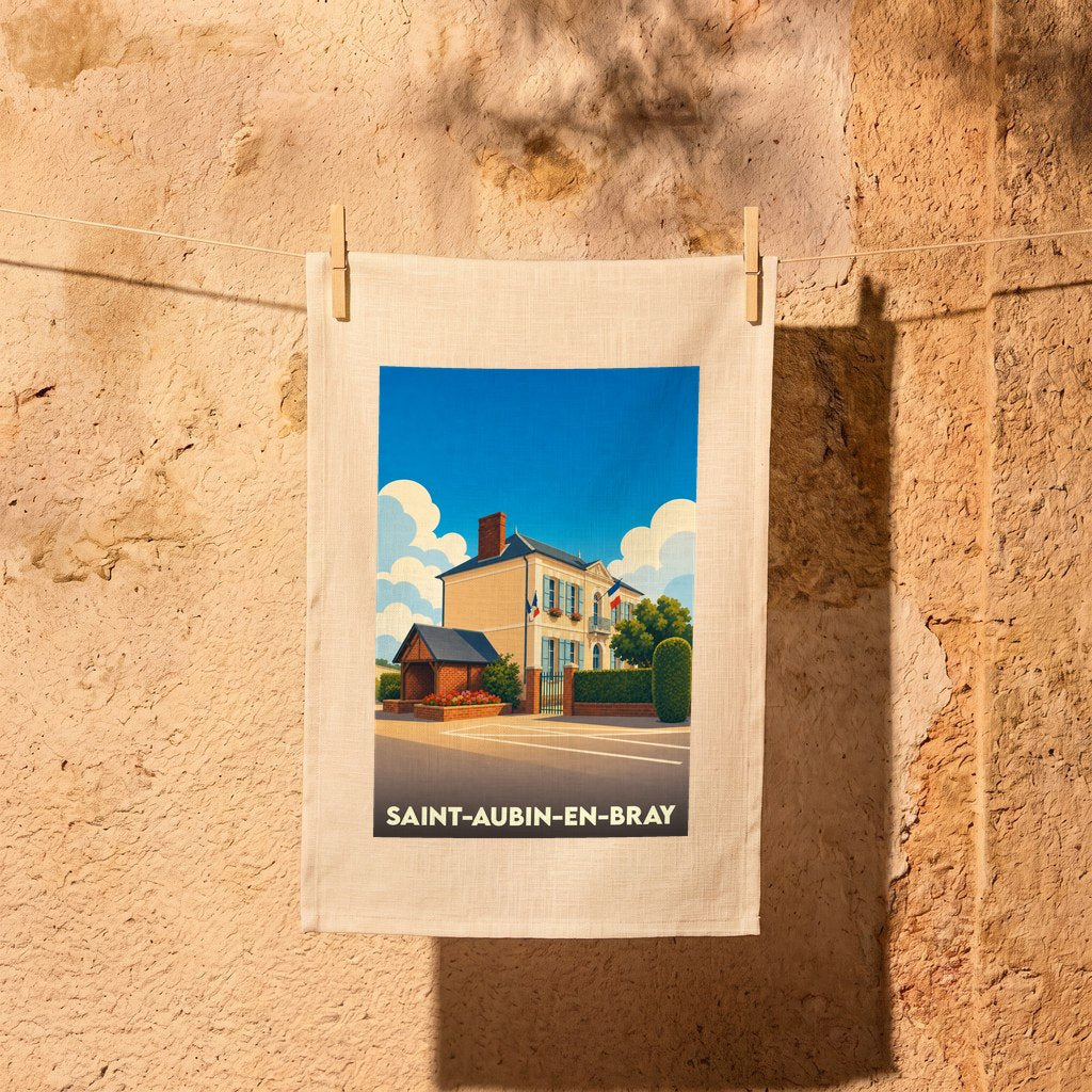 Torchon souvenir de la ville de Saint-Aubin-en-Bray avec une illustration stylisée d'une bâtisse locale.