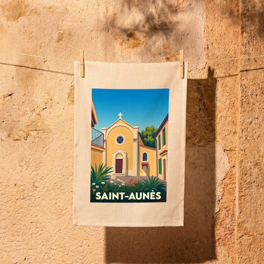 Torchon souvenir de la ville de Saint-Aunès avec une illustration stylisée de son église.