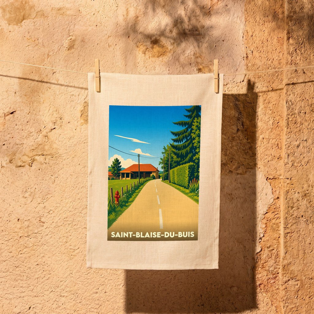 Torchon souvenir de la ville de Saint-Blaise-du-Buis avec une illustration stylisée de paysage champêtre.
