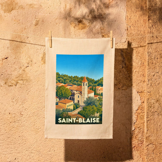 Torchon souvenir de la ville de Saint-Blaise avec une illustration stylisée d'un village provençal.