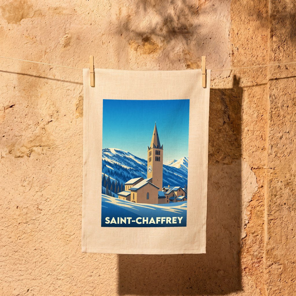 Torchon souvenir de la ville de Saint-Chaffrey avec une illustration stylisée d'un village de montagne enneigé.