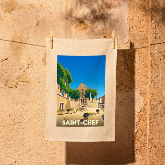 Torchon souvenir de la ville de Saint-Chef avec une illustration stylisée d'une place ensoleillée.