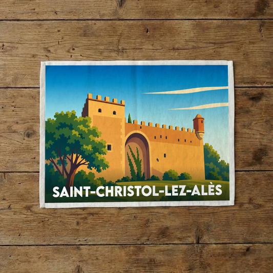 Torchon souvenir de la ville de Saint-Christol-lez-Alès avec une illustration stylisée de ses remparts.