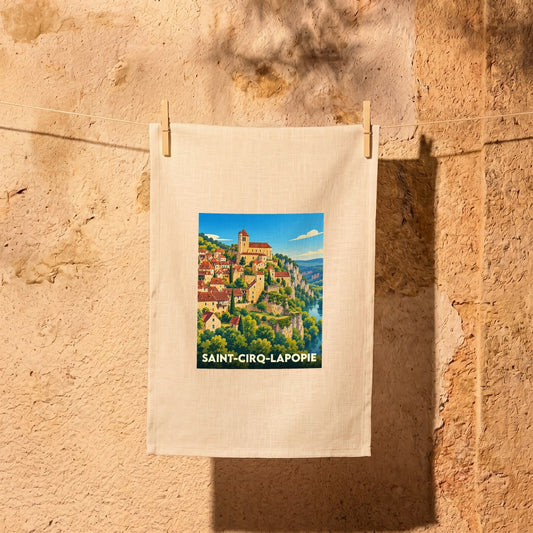 Torchon souvenir de la ville de Saint-Cirq-Lapopie avec une illustration stylisée.