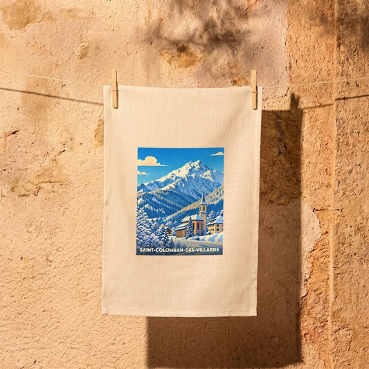 Torchon souvenir de la ville de Saint-Colomban-des-Villards avec une illustration hivernale stylisée.
