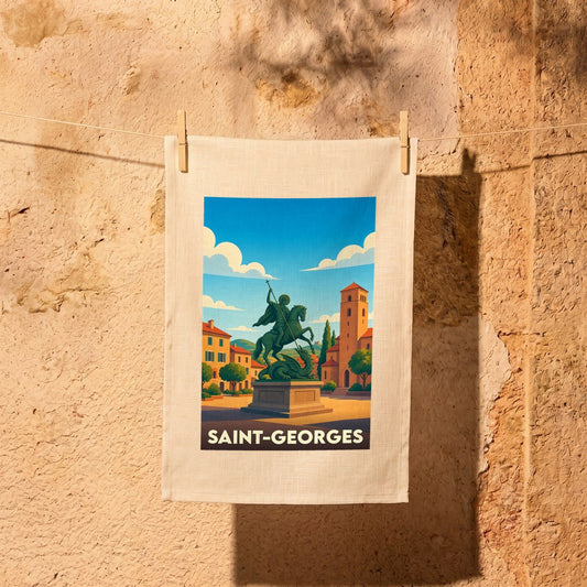 Torchon souvenir de la ville de Saint-Georges avec une illustration stylisée d'une statue équestre sur une place ensoleillée.