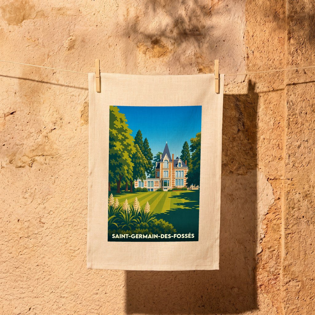 Torchon souvenir de la ville de Saint-Germain-des-Fossés illustré d'un manoir entouré de jardins verdoyants.