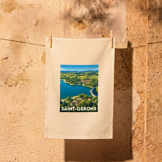Torchon souvenir de la ville de Saint-Gérons avec une illustration paysagère stylisée.