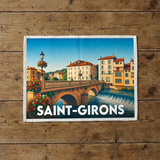 Torchon souvenir de la ville de Saint-Girons avec une illustration stylisée.