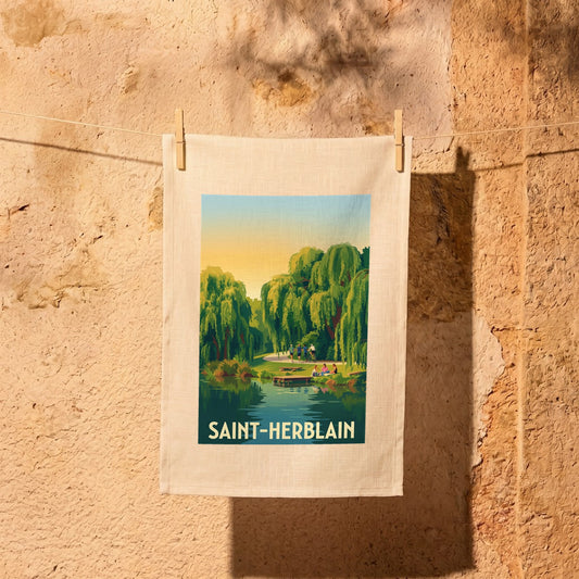 Torchon souvenir de la ville de Saint-Herblain avec une illustration stylisée d'un parc paysager au bord de l'eau.