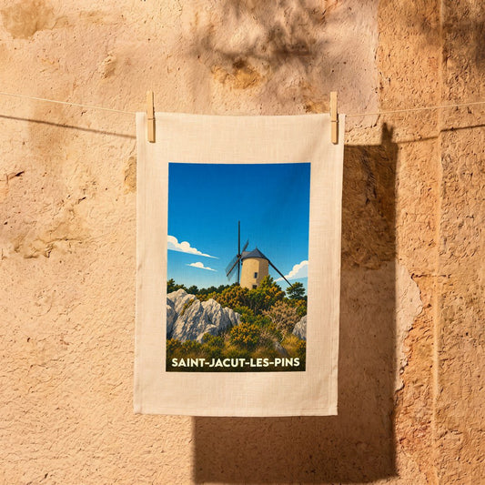 Torchon de cuisine souvenir de la ville de Saint-Jacut-les-Pins illustré par un moulin à vent stylisé.