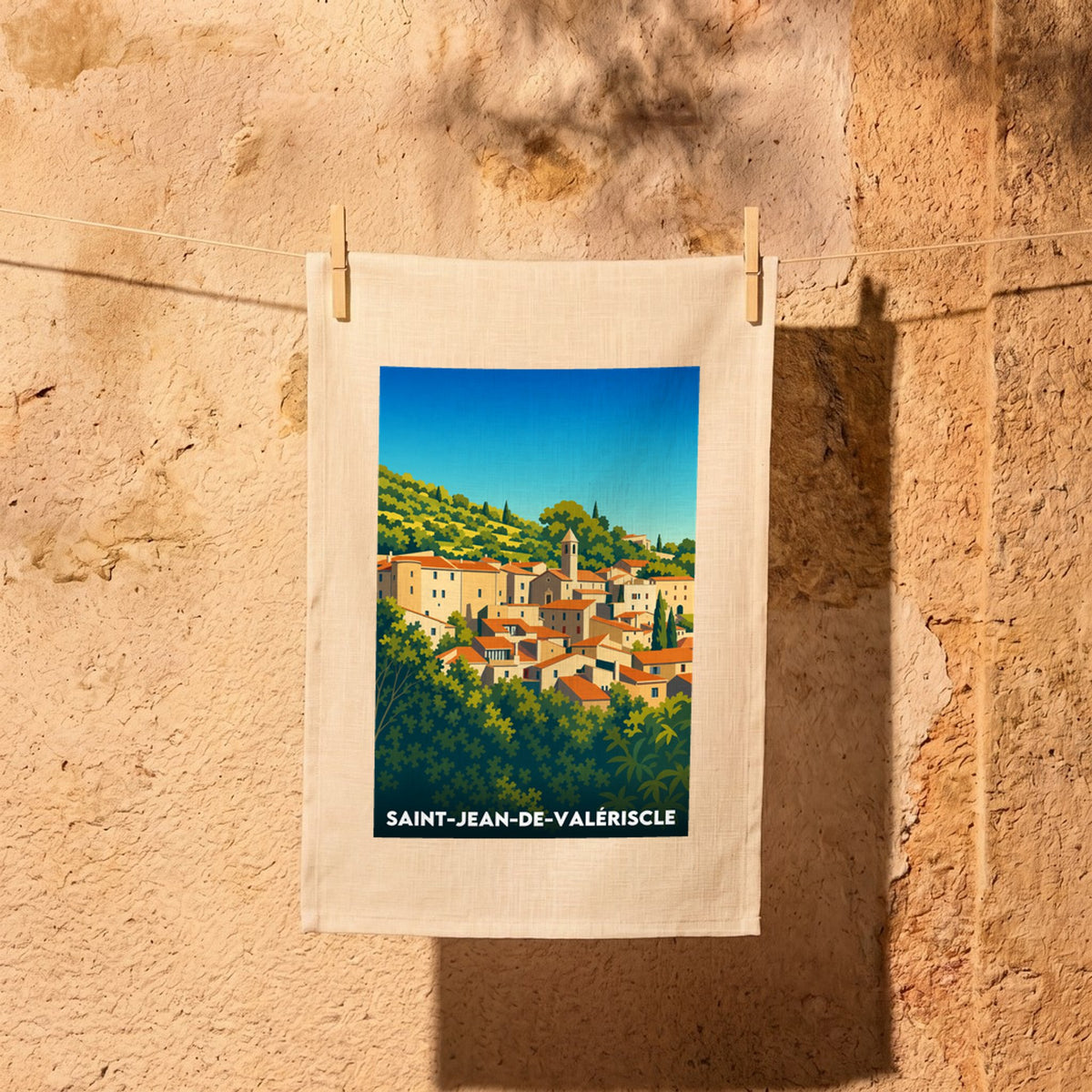 Torchon souvenir de la ville de Saint-Jean-de-Valériscle avec une illustration stylisée.