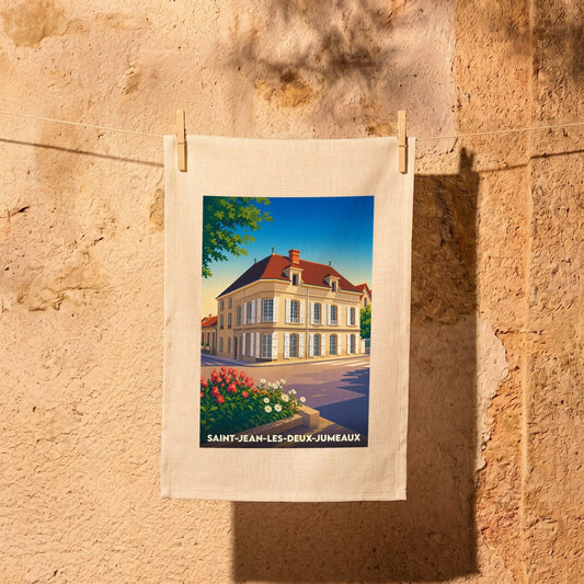 Torchon souvenir de la ville de Saint-Jean-les-Deux-Jumeaux avec une illustration stylisée d'une bâtisse historique.