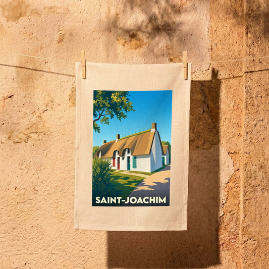 Torchon souvenir de la ville de Saint-Joachim avec une illustration stylisée d'une chaumière traditionnelle.