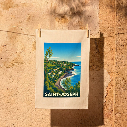 Torchon souvenir de la ville de Saint-Joseph avec une illustration stylisée d'un paysage côtier.
