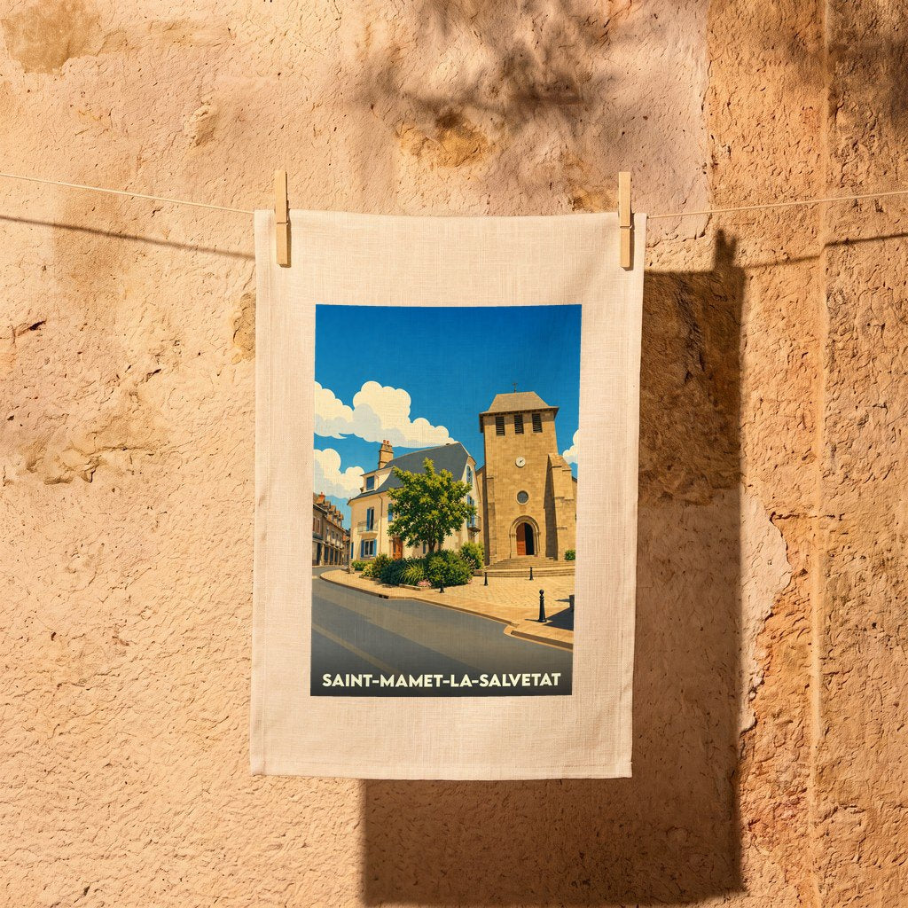 Torchon souvenir de la ville de Saint-Mamet-la-Salvetat avec une illustration stylisée.