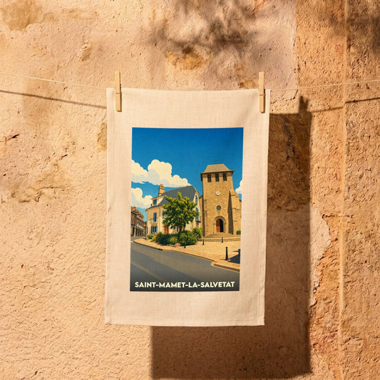 Torchon souvenir de la ville de Saint-Mamet-la-Salvetat avec une illustration stylisée.