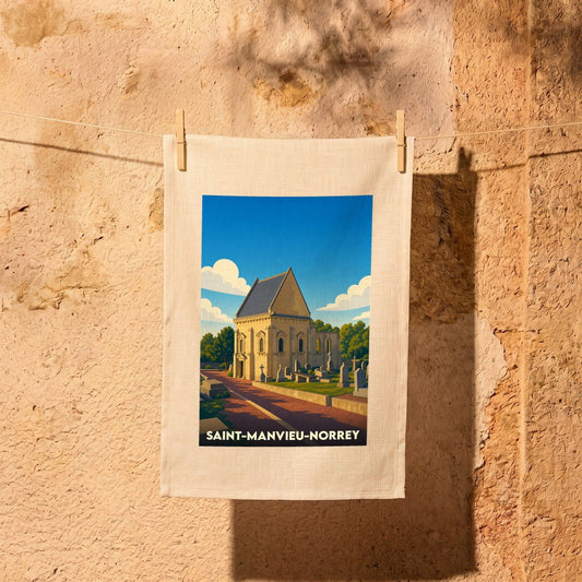 Torchon souvenir de la ville de Saint-Manvieu-Norrey avec une illustration stylisée d'une église et de son cimetière.
