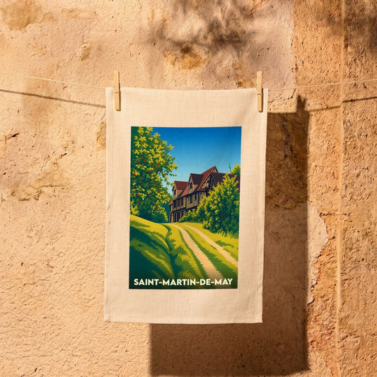 Torchon souvenir de la ville de Saint-Martin-de-May avec une illustration stylisée d'un manoir normand.