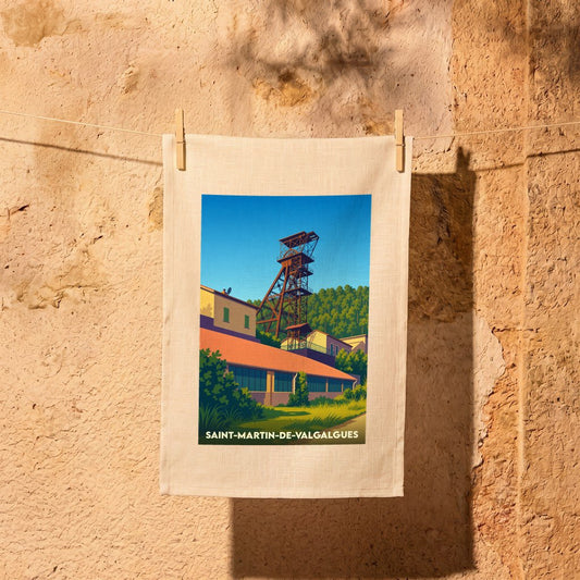 Torchon souvenir de la ville de Saint-Martin-de-Valgalgues illustré d'un chevalement minier stylisé.