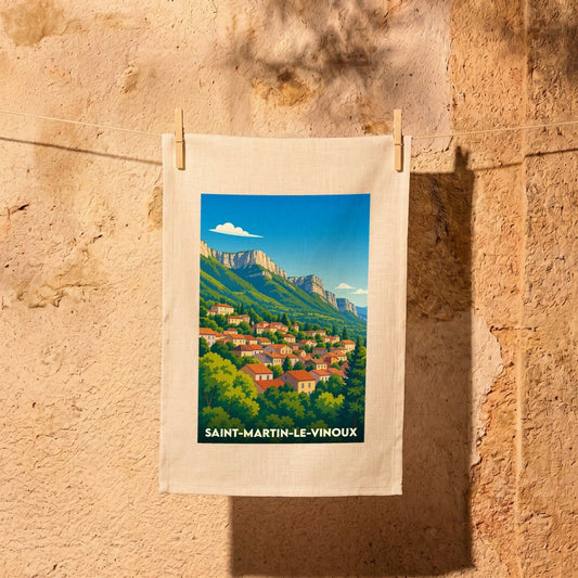 Torchon souvenir de la ville de Saint-Martin-le-Vinoux avec une illustration stylisée de son paysage montagneux.