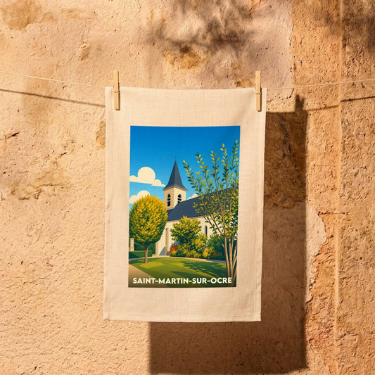 Torchon souvenir de la ville de Saint-Martin-sur-Ocre avec une illustration stylisée d'une église sous un ciel bleu.