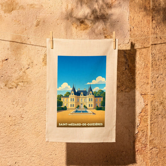 Torchon souvenir de la ville de Saint-Médard-de-Guizières avec une illustration stylisée de château.