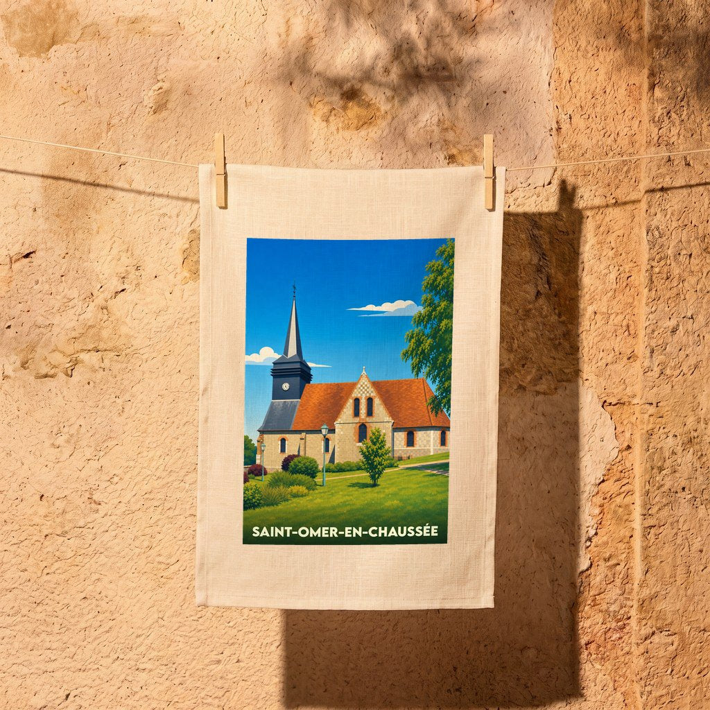 Torchon souvenir de Saint-Omer-en-Chaussée orné d'une illustration stylisée de son église et de son clocher.