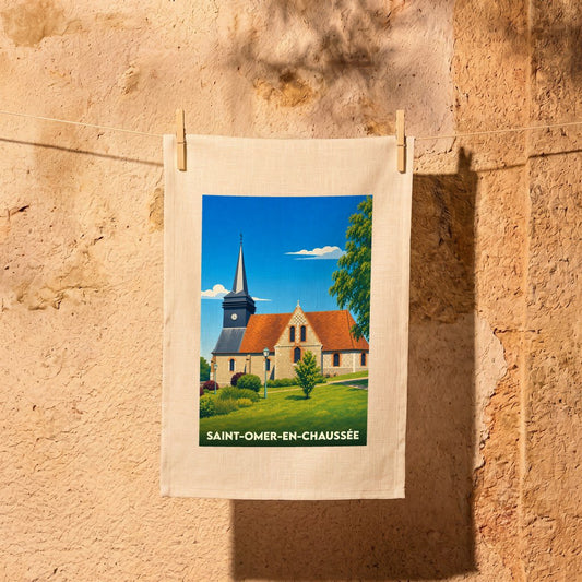 Torchon souvenir de Saint-Omer-en-Chaussée orné d'une illustration stylisée de son église et de son clocher.