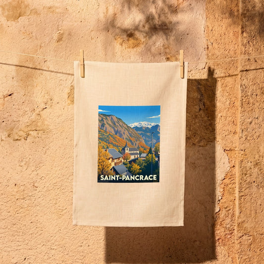 Torchon souvenir de la ville de Saint-Pancrace illustré d'un paysage de montagne stylisé.