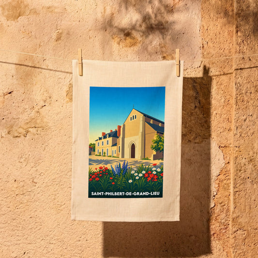 Torchon souvenir de la ville de Saint-Philbert-de-Grand-Lieu avec une illustration stylisée de son église.