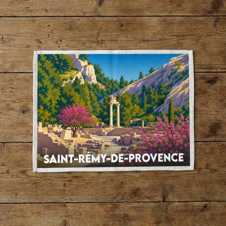 Torchon souvenir de la ville de Saint-Rémy-de-Provence illustré d'un paysage stylisé de ruines antiques dans un décor provençal.