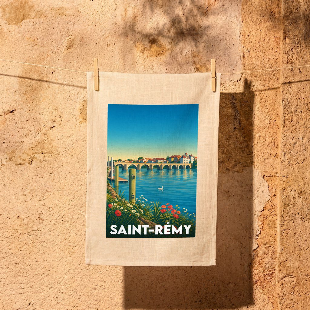 Torchon souvenir de la ville de Saint-Rémy avec une illustration stylisée d'un pont et d'un plan d'eau.