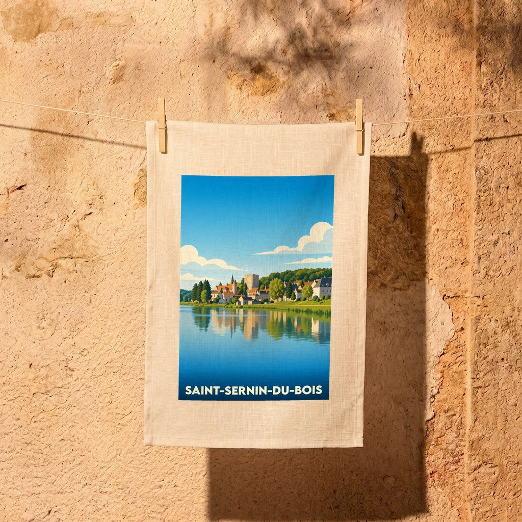 Torchon souvenir de la ville de Saint-Sernin-du-Bois avec une illustration stylisée d'un paysage lacustre.