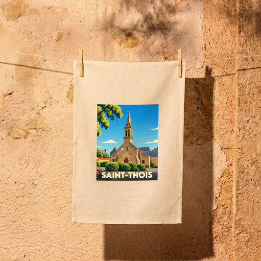 Torchon souvenir de la ville de Saint-Thois illustré par une vue stylisée de son église sous un ciel bleu.