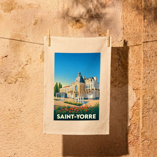 Torchon souvenir de la ville de Saint-Yorre avec une illustration stylisée d'un bâtiment thermal.